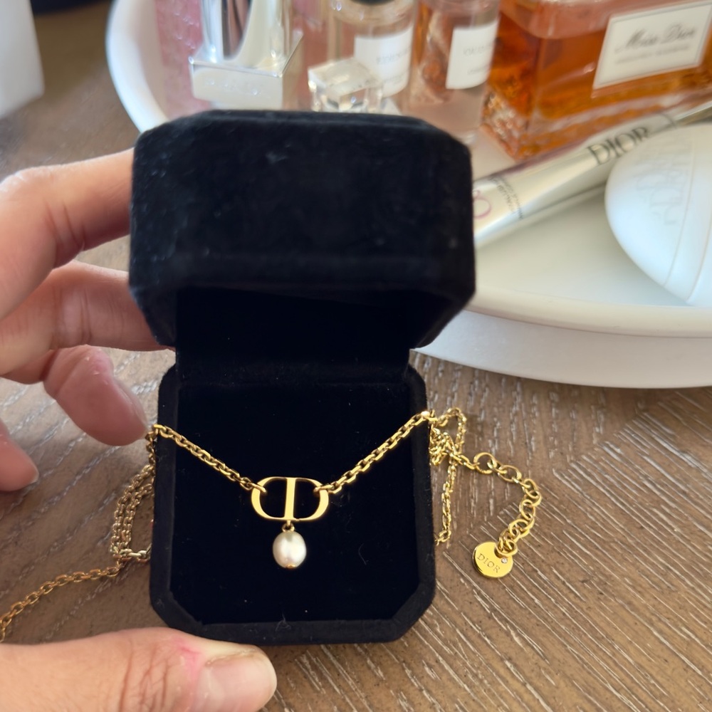 Dior Petit CD Necklace and Earrings
Gold finish metal. 
Condition: Good
